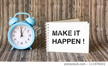 Text on notepad on wooden background Make it happen Text on notepad on wooden background Make it happen 111076832