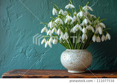 Snowdrops: a fresh bouquet in a decorative vase 111077538