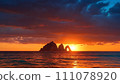 Island silhouette at sunset 111078920