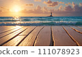Lighthouse view: wooden boardwalk and ocean 111078923