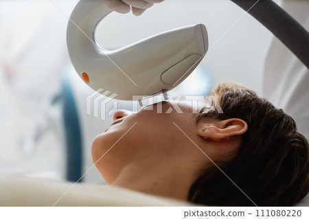 Phototherapy, photorejuvenation, IPL in a beauty salon. Care for a woman's face. Phototherapy, photorejuvenation, IPL in a beauty salon. Care for a woman's face. 111080220