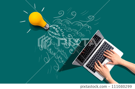 Idea light bulb flying to the sky like a rocket from a laptop computer 111080299
