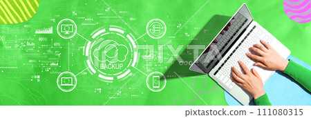 Backup concept with person using a laptop 111080315