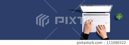 Person using a laptop computer 111080322
