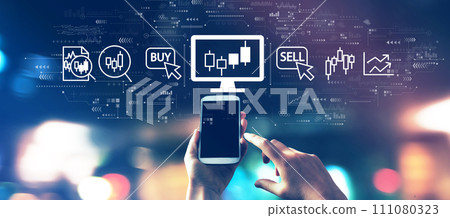 Stock trading theme with a smartphone in city lights at night 111080323