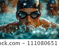 A swimmer wearing swim goggles in a pool. 111080651