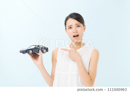 A woman with a car model 111080963