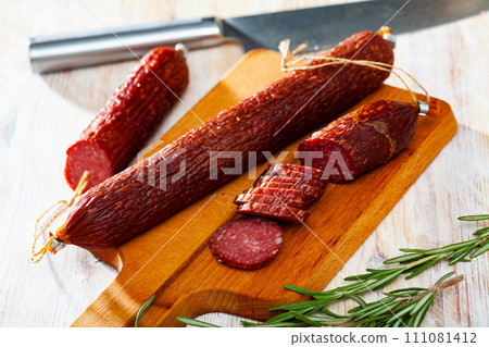 Raw smoked salami with fresh rosemary 111081412