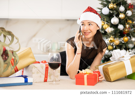 girl in New Year s atmosphere speaks on phone 111081972