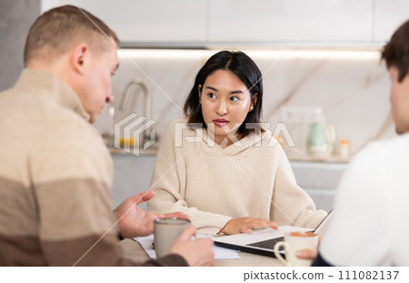 Couple young woman and guy discussing deal with agent 111082137