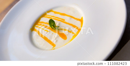 Cream mousse with passion fruit Cream mousse with passion fruit 111082423