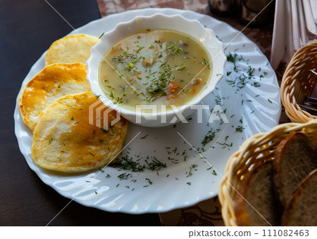 Traditional Belarusian machanka with pancakes Traditional Belarusian machanka with pancakes 111082463