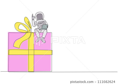 Continuous one line drawing young energetic astronaut sitting on giant gift box holding laptop raise one hand. Awesome space gift. Cosmonaut outer space. Single line draw design vector illustration 111082624