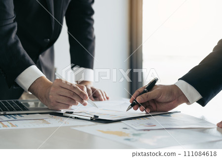 Two businessman team calculate about summary report annual on table office. 111084618