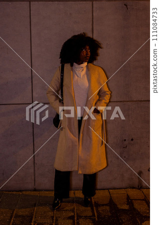 Nighttime Nonchalance: Casual Elegance Against an Urban Canvas Nighttime Nonchalance: Casual Elegance Against an Urban Canvas 111084733