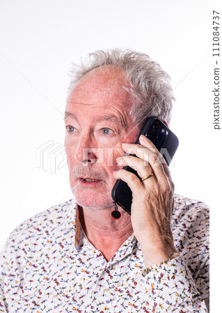 Senior Man Engaged in a Smartphone Conversation 111084737