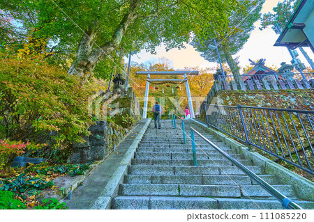 Torii of Ikaho Shrine at the top of 365 steps of Ikaho Onsen Sekidangai in Ikaho Town, Gunma Prefecture in autumn Torii of Ikaho Shrine at the top of 365 steps of Ikaho Onsen Sekidangai in Ikaho Town, Gunma Prefecture in autumn 111085220