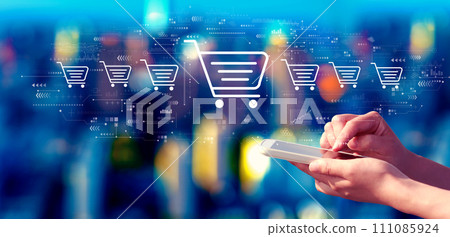 Online shopping theme with person using a smartphone at night Online shopping theme with person using a smartphone at night 111085924