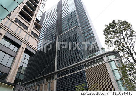 Urban Structure Against Blue Sky with Mesh Fence Barrier Nov 26 2023 111086413