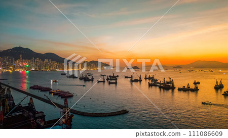 Sunset over the City Skyline with Ocean Reflections Dec 25 2023 Sunset over the City Skyline with Ocean Reflections Dec 25 2023 111086609