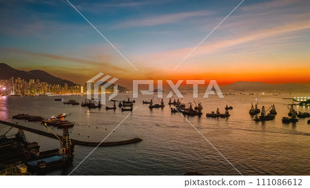 Sunset over the City Skyline with Ocean Reflections Dec 25 2023 Sunset over the City Skyline with Ocean Reflections Dec 25 2023 111086612