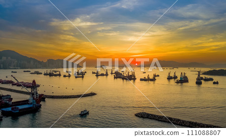 Sunset over the City Skyline with Ocean Reflections Dec 25 2023 Sunset over the City Skyline with Ocean Reflections Dec 25 2023 111088807