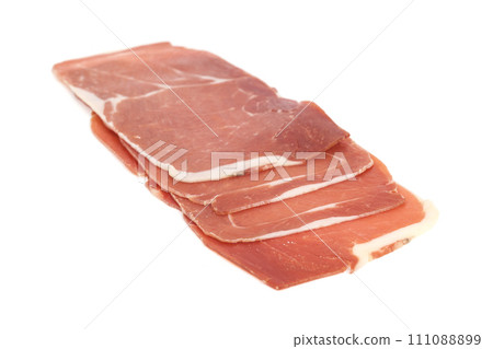 closeup on a piece of spanish serrano ham 111088899