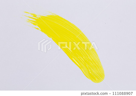 Yellow paint on white paper 111088907