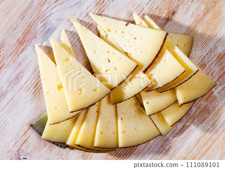 Slices of semi-hard cheese Slices of semi-hard cheese 111089101