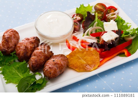 Cevapcici with green salad Cevapcici with green salad 111089181