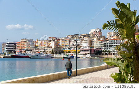 Sarande cityscape on Ionian Sea with residential area and harbor 111089193