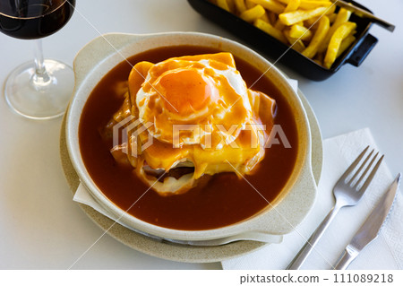 Francesinha - typical tasty food from Porto. Portuguese cuisine Francesinha - typical tasty food from Porto. Portuguese cuisine 111089218