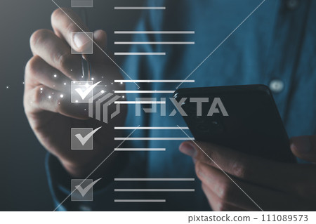 Businessman check mark on the screen of checklist box. business checklist and digital document concept. Businessman check mark on the screen of checklist box. business checklist and digital document concept. 111089573