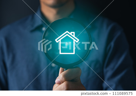 real estate investing concept.businessman using magnifier for searching and buying house 111089575