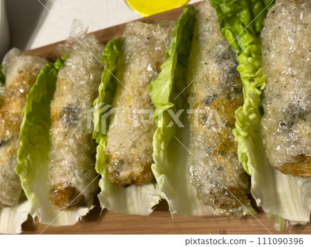 Asian nem dish on a bed of salad Asian nem dish on a bed of salad 111090396