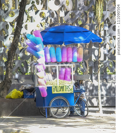 Mexico City, Mexico. Jan 14, 2024. A street vendor in Mexico City, with a bicycle, sells cotton candy. 111090504