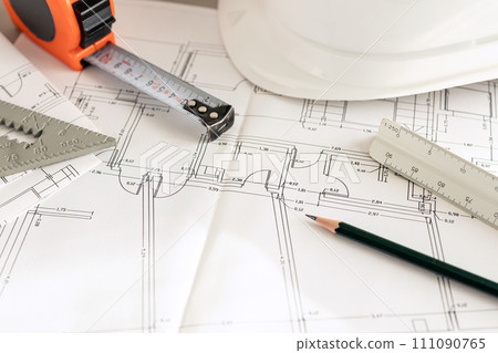 Architecture plans and contractor supplies on desk Close up. Copy space Architecture plans and contractor supplies on desk Close up. Copy space 111090765