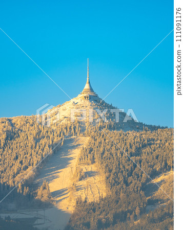 Jested Mountain with unique hotel and TV transmitter on the top on sunny winter day, Liberec, Czechia 111091176