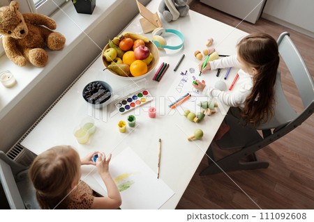 Two little girls drawing together Two little girls drawing together 111092608