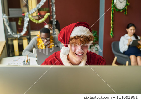 Young Santa networking in office Young Santa networking in office 111092961