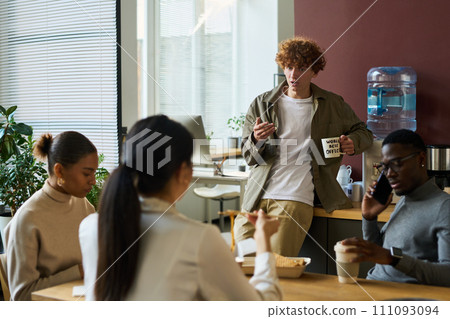 Talking to colleagues at lunch break Talking to colleagues at lunch break 111093094