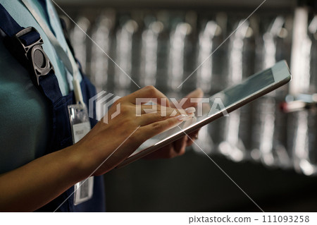 Hand of female engineer with tablet Hand of female engineer with tablet 111093258