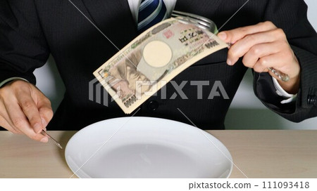 Image of a businessman eating a luxurious meal Image of a businessman eating a luxurious meal 111093418