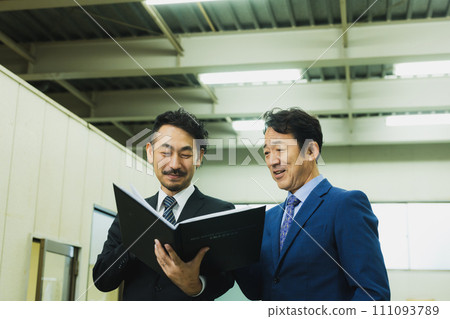 2 middle businessmen 111093789