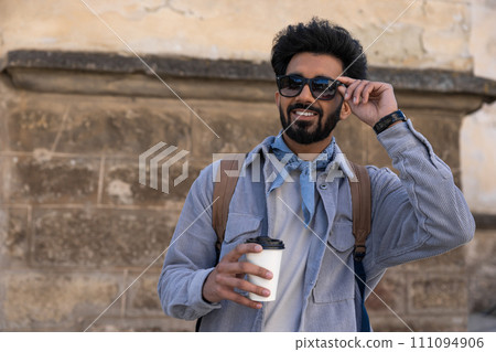 Young hindu man in eyeglasses feeling happy and contented 111094906