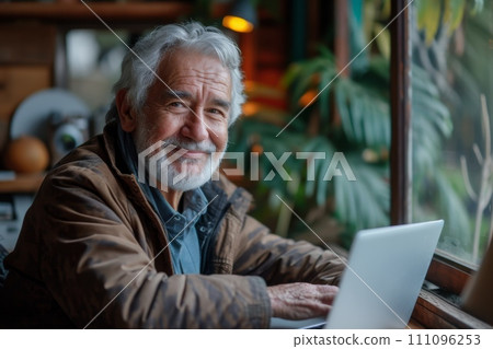 older man smile face using a laptop older man smile face using a laptop 111096253