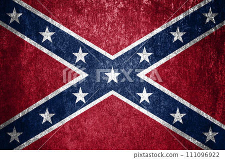 Close-up of grunge Confederate States of America flag. Dirty Confederate States of America flag on a metal surface. Close-up of grunge Confederate States of America flag. Dirty Confederate States of America flag on a metal surface. 111096922