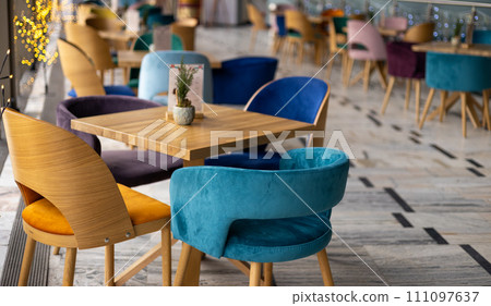 Modern interior of urban restaurant or cafe with dining places, daytime 111097637