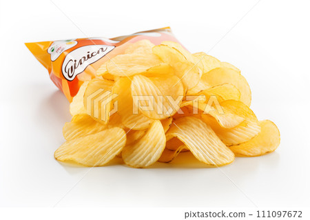 Opened packing of potato chips isolated on white background. Close up 111097672