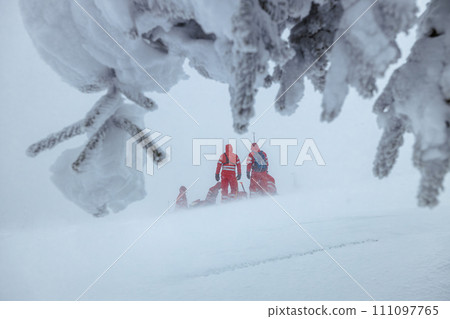 Team of emergency service in winter in mountains. Team of emergency service in winter in mountains. 111097765